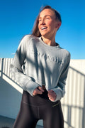 Earthletica Co-Founder, Libby Babet, wearing the Streetwise Sweater