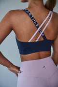 A close up shot of Earthletica's Into The Blue Crop and Lilac Dreaming Bike Shorts, from behind.